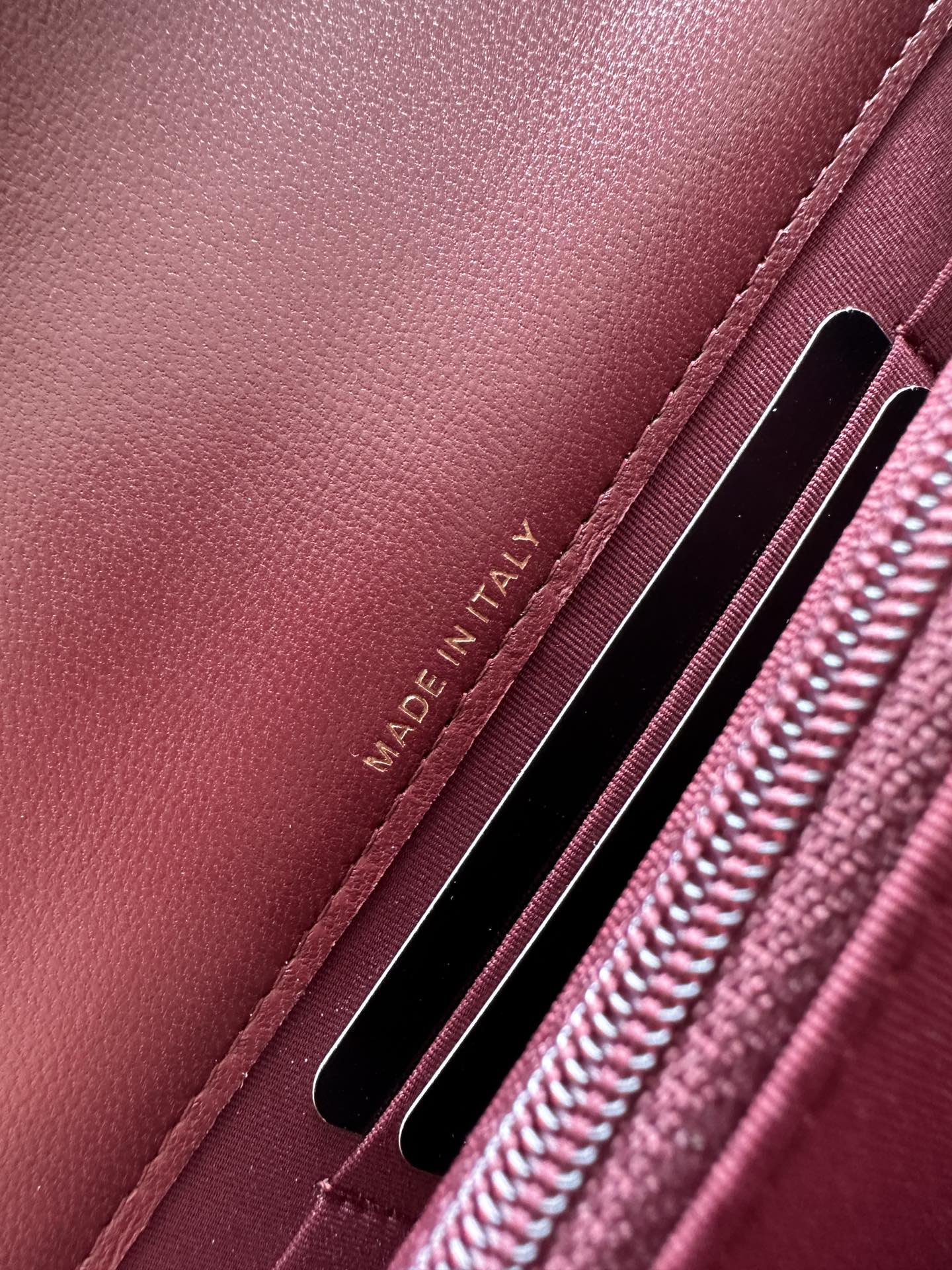 Burgundy leather interior label and twin card slots, MADE IN ITALY