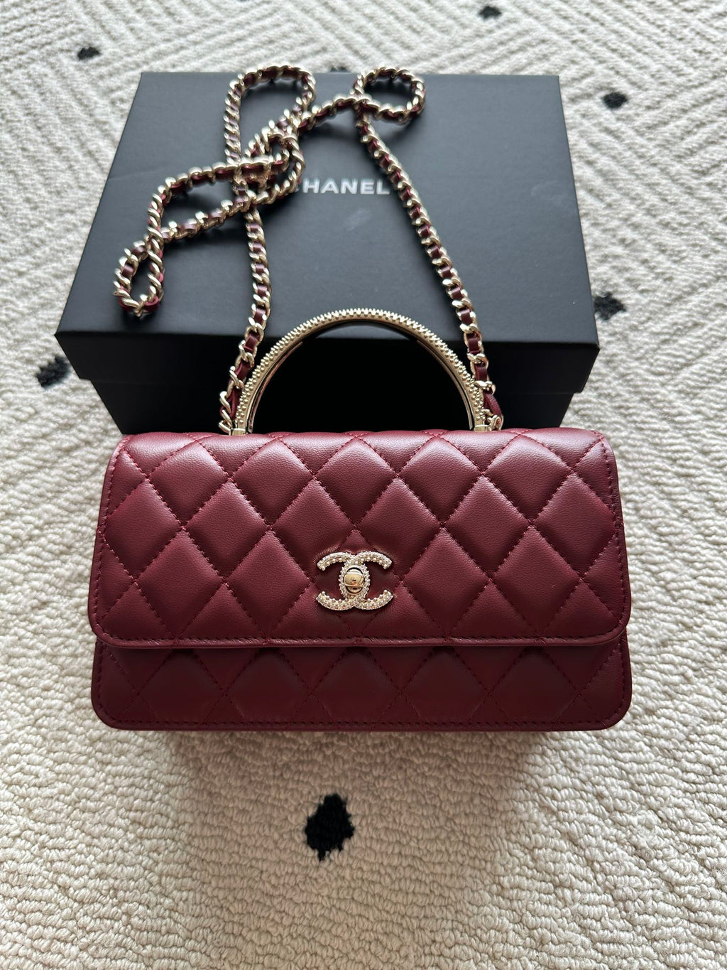 Chanel quilted shoulder bag with chain strap and logo clasp, burgundy leather