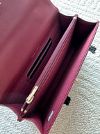 Burgundy leather shoulder bag interior with card slots and clasp