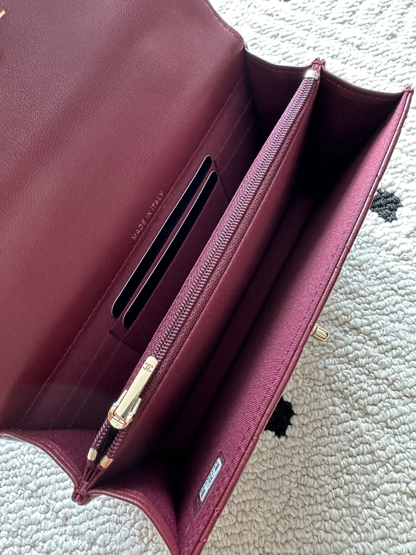Burgundy leather shoulder bag interior with card slots and clasp