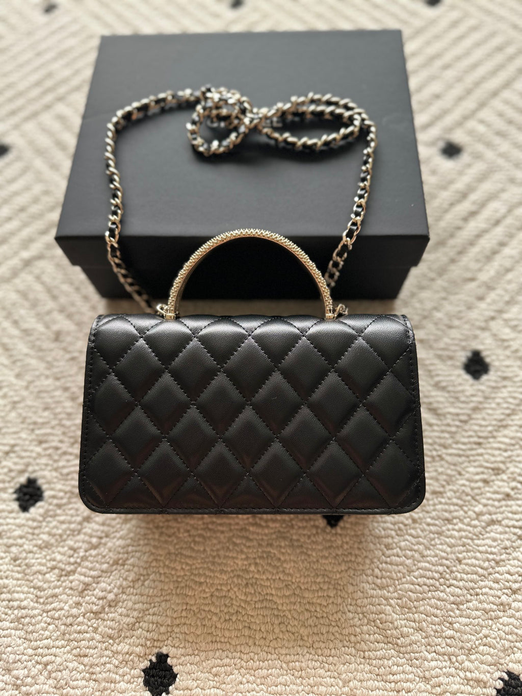 Chanel mini black quilted flap bag with round handle and chain strap