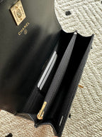 Chanel quilted black mini bag open view with zipper and interior lining