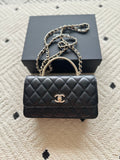 Chanel mini black quilted flap bag with chain strap and gold CC logo