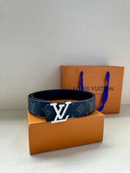 Louis Vuitton belt with dark navy monogram pattern and large silver LV buckle on strap