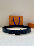 Louis Vuitton belt in dark navy with monogram pattern and silver-tone buckle in center