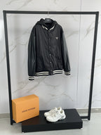 Prada black hooded bomber jacket with triangular logo on chest
