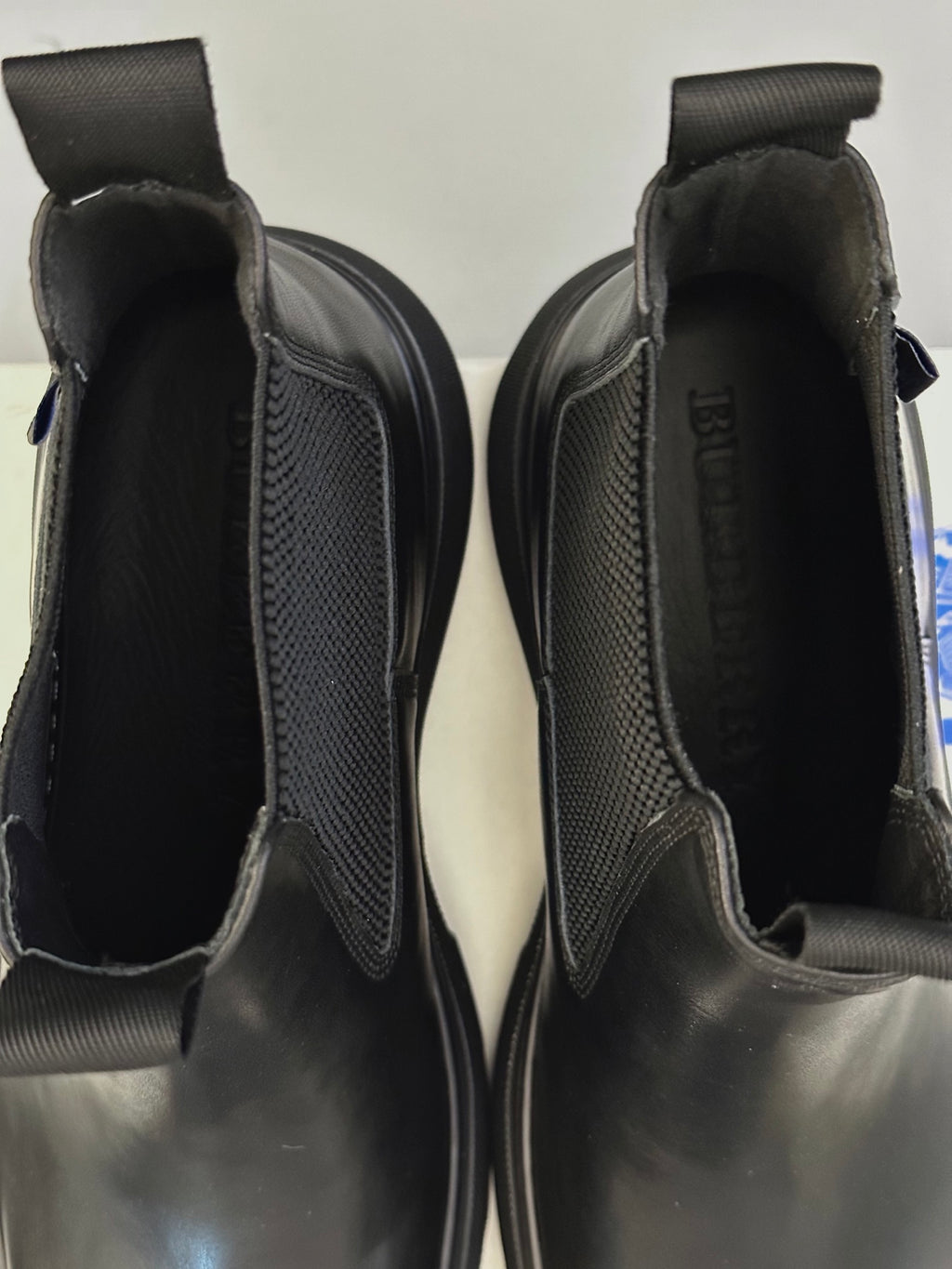 Black Chelsea boots close-up of elastic gore and interior lining