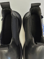 Black Chelsea boots close-up of elastic gore and interior lining