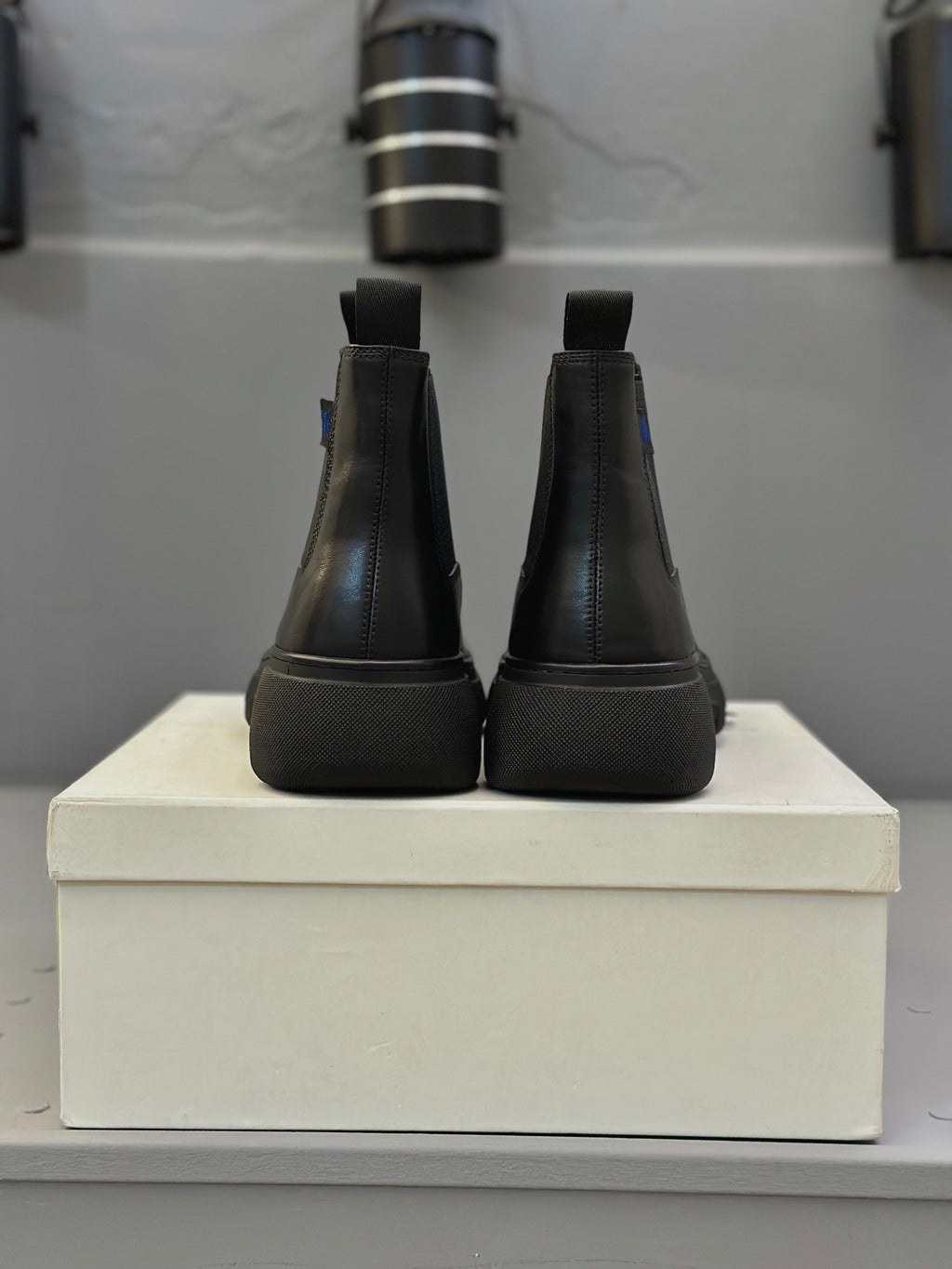Black Chelsea boots rear view with elastic panels and chunky sole