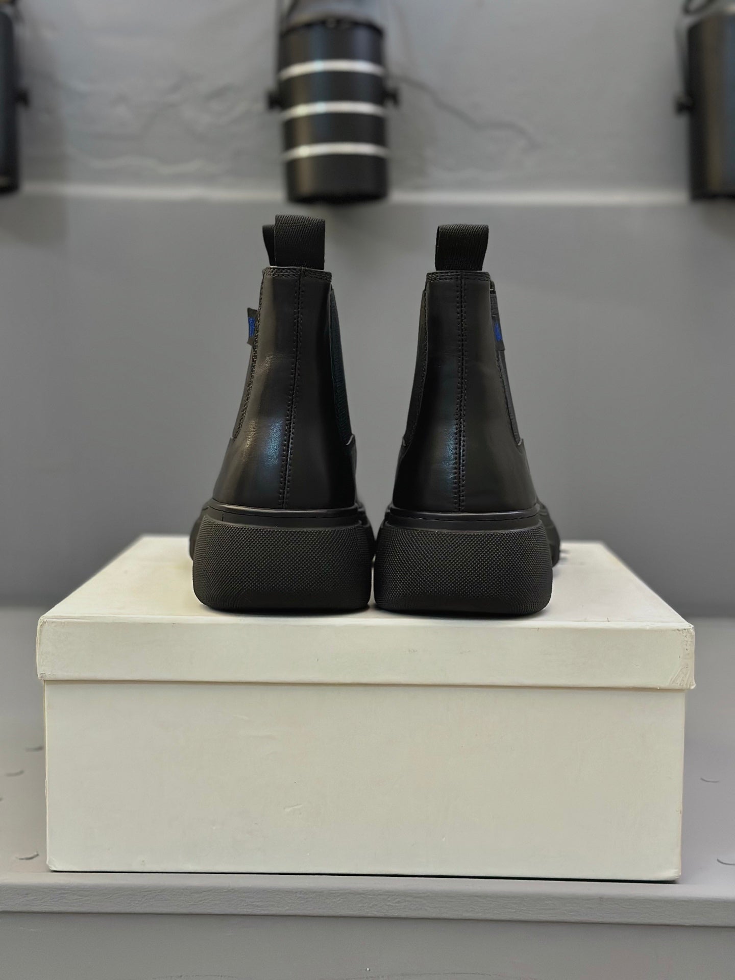 Black Chelsea boots rear view with elastic panels and chunky sole
