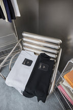 Prada T-shirts on folded metal stand: white and black