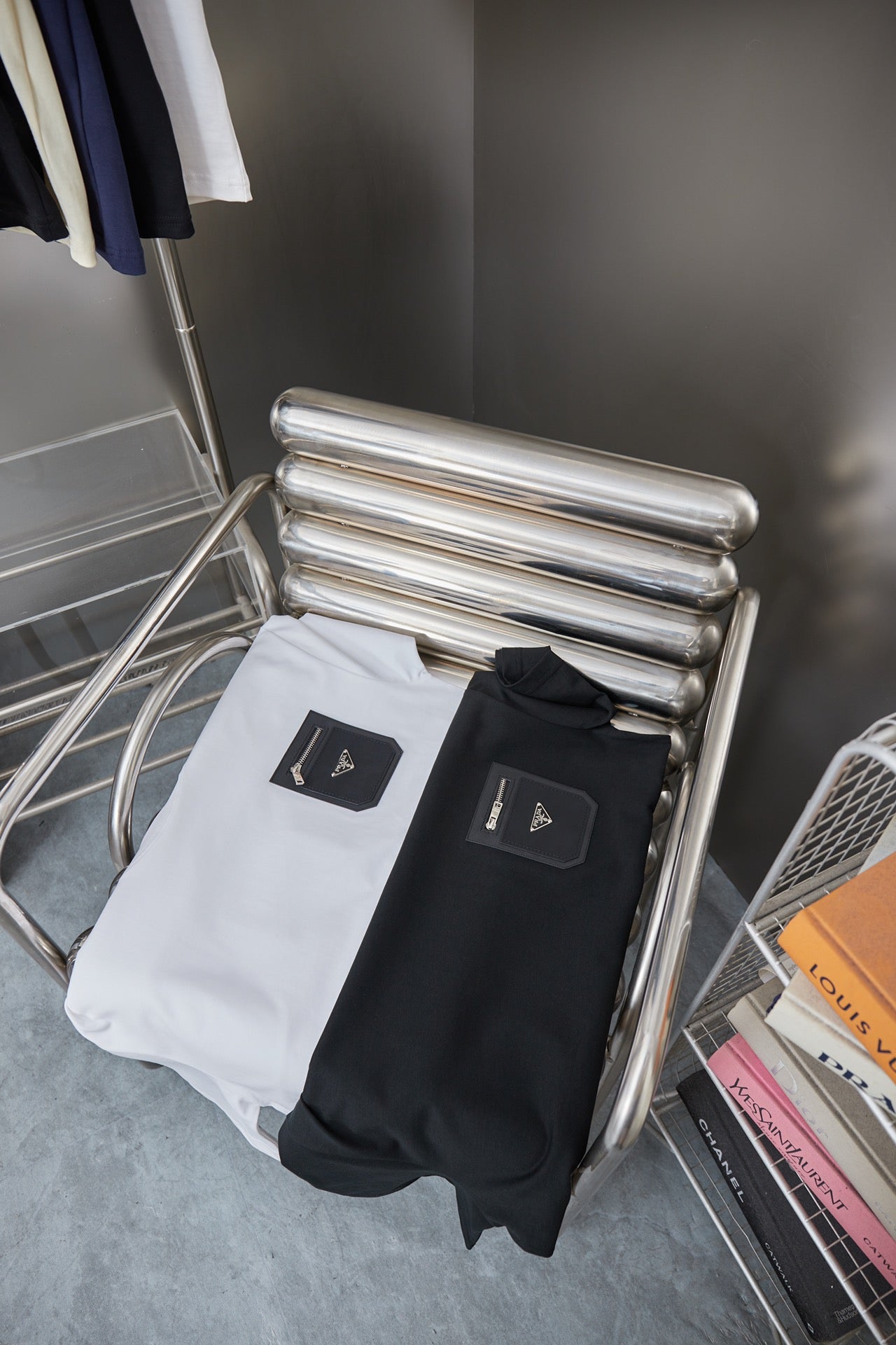 Prada T-shirts on folded metal stand: white and black