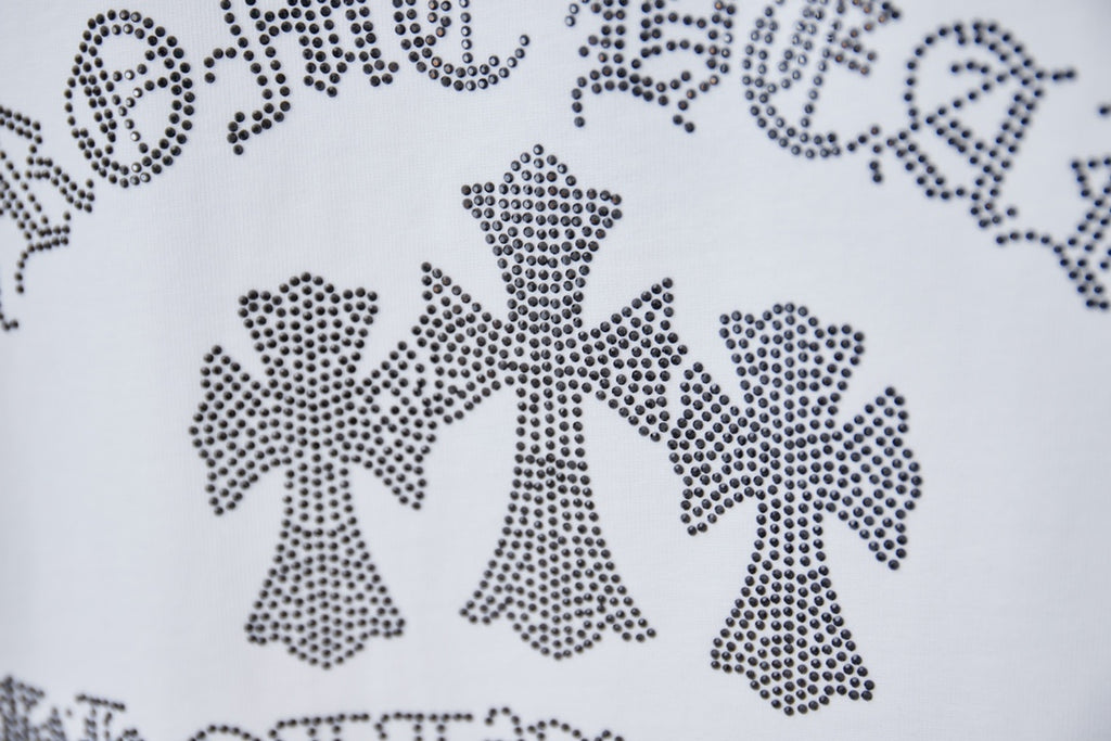 Rhinestone bow motif on white T-shirt graphic detail