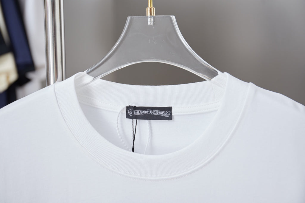 White crewneck T-shirt close-up with brand tag at neckline
