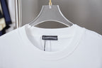 White crewneck T-shirt close-up with brand tag at neckline