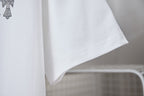 White T-shirt sleeve and curved hem detail