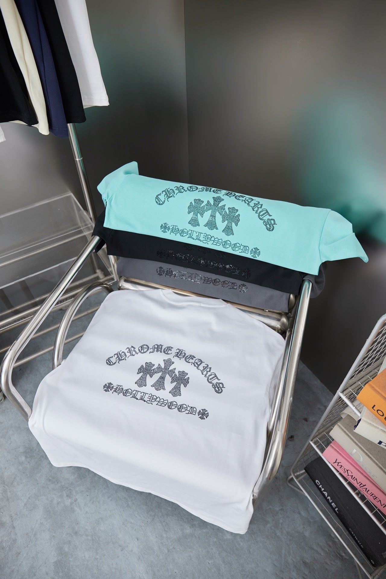 Turquoise graphic T-shirt with rhinestone back text and bow graphic