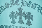 Turquoise T-shirt close-up of rhinestone-style text and bows graphic