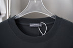 Dark crew-neck T-shirt with inner neckline tag and rhinestone logo stitch detail