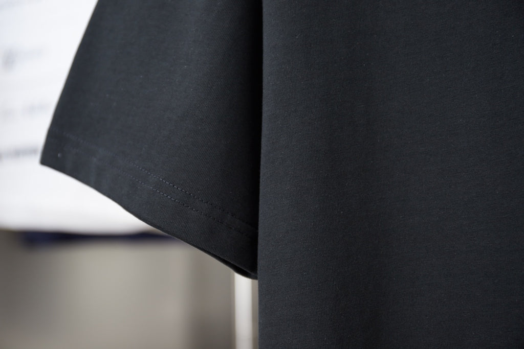 Dark short-sleeve T-shirt with clean curved hem