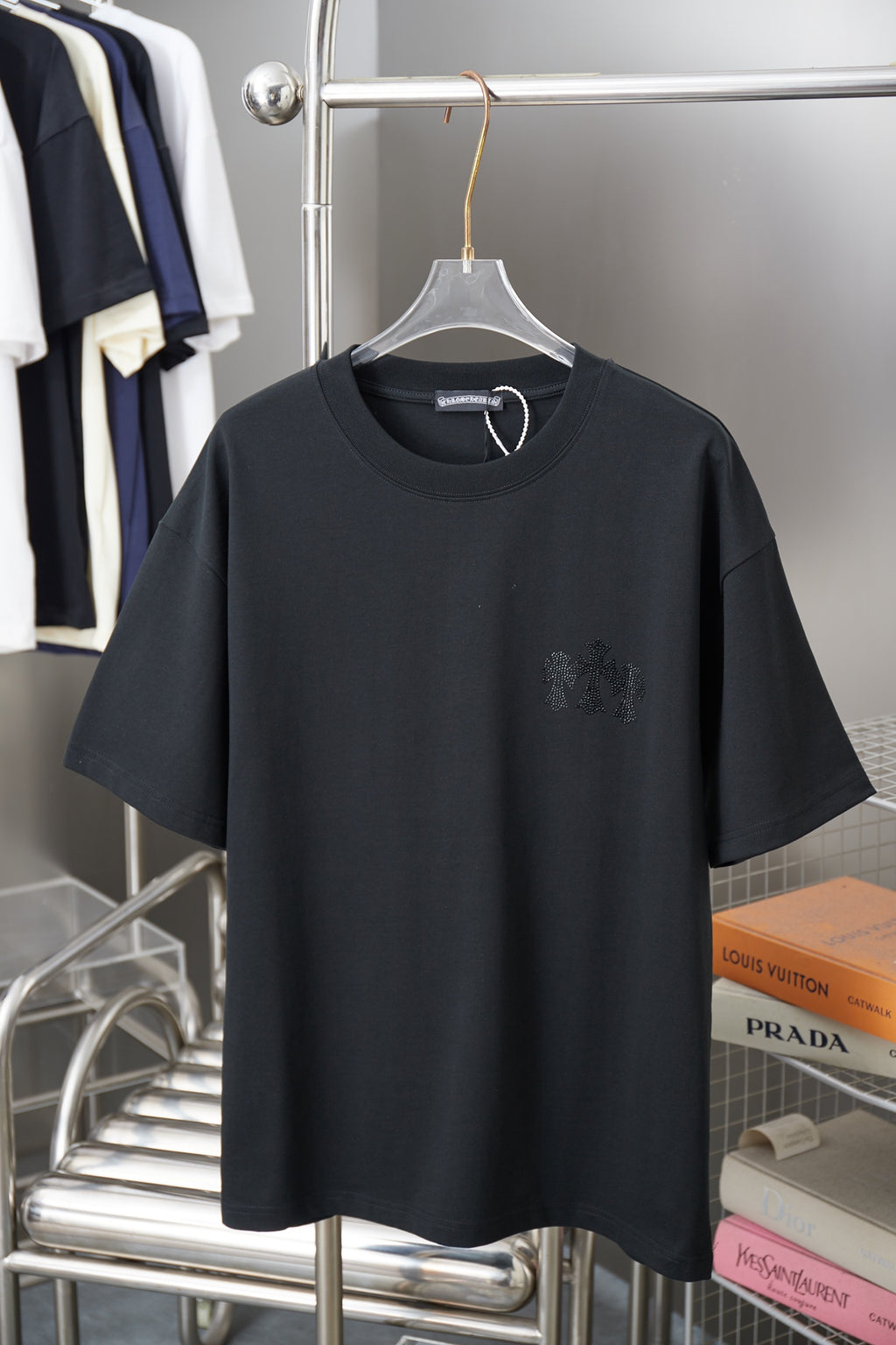 Dark short-sleeve T-shirt with rhinestone floral logo on the chest
