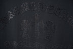 Dark T-shirt featuring an all-over rhinestone logo motif