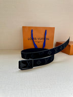 Black monogram belt with silver-tone square buckle, angled view