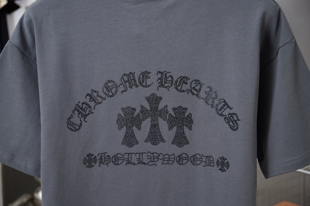 Back of dark gray short-sleeve T-shirt with rhinestone cross-and-text graphic