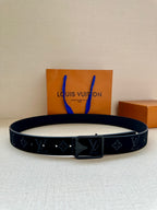 Black monogram belt with rectangular silver-tone buckle
