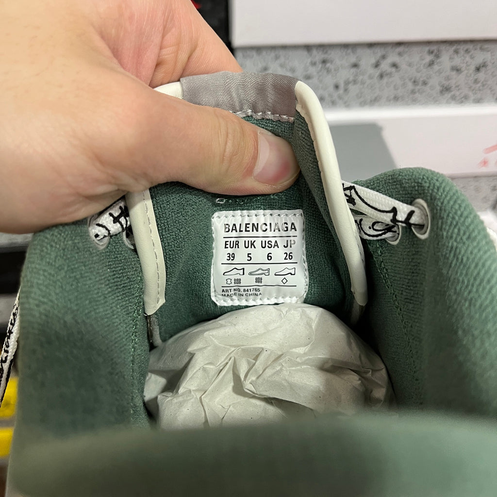 Balenciaga size label on white sneaker lining, showing UK/JP size details.