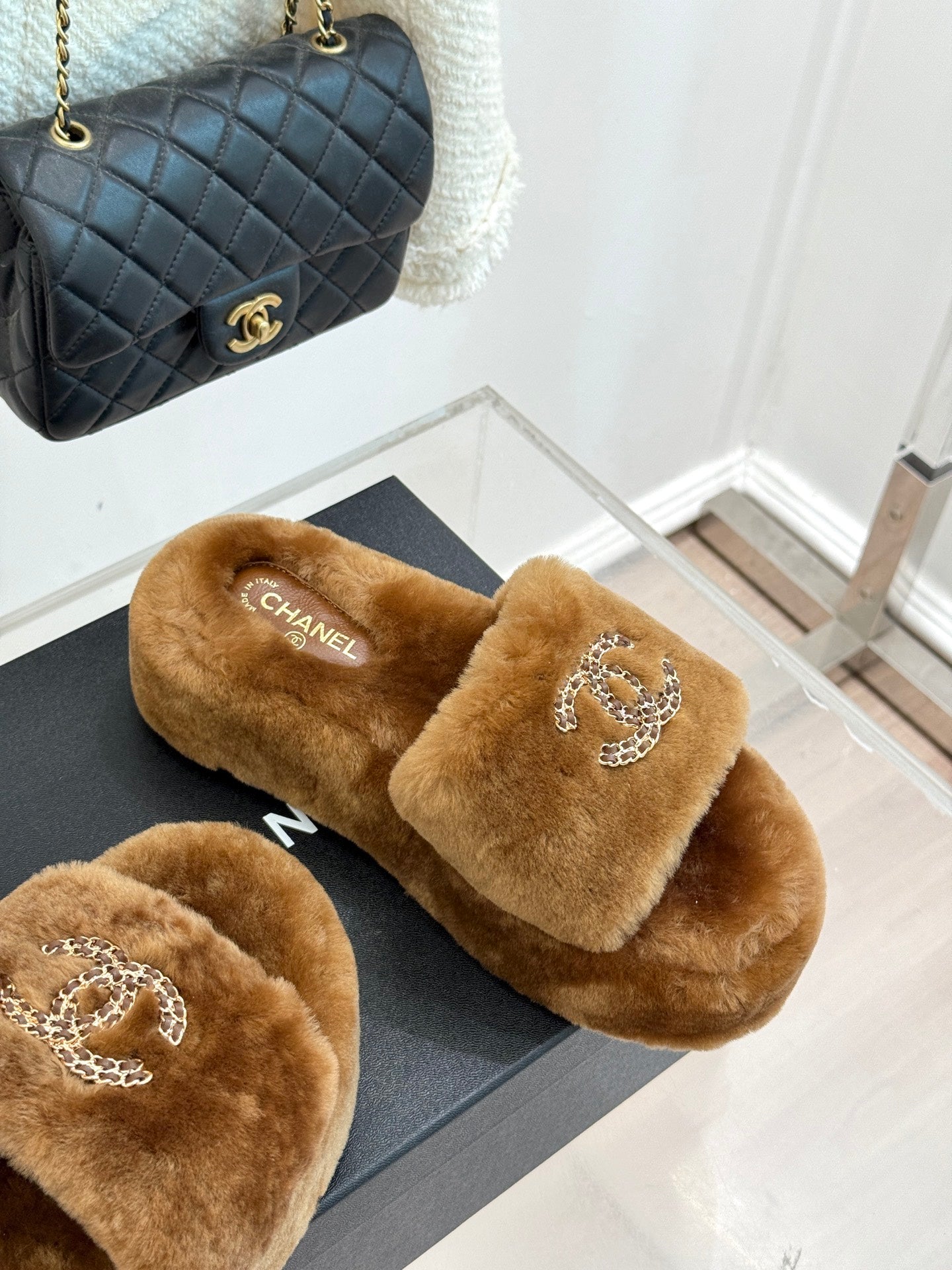 Brown plush slide slippers with Chanel rhinestone CC on front strap