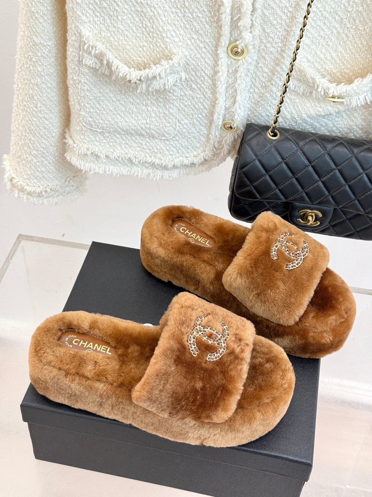 Brown plush slide slippers with Chanel rhinestone CC on front straps