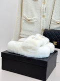 White faux-fur slide sandals with gold-tone jeweled C logo on upper