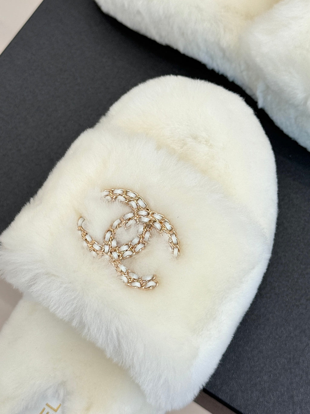 White faux-fur slide sandal with gold-tone jeweled C logo detail