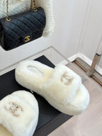White faux-fur slide sandals with gold-tone jeweled C logo on top