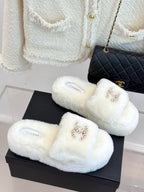 White faux-fur slide sandals with jeweled C logo and Chanel insole