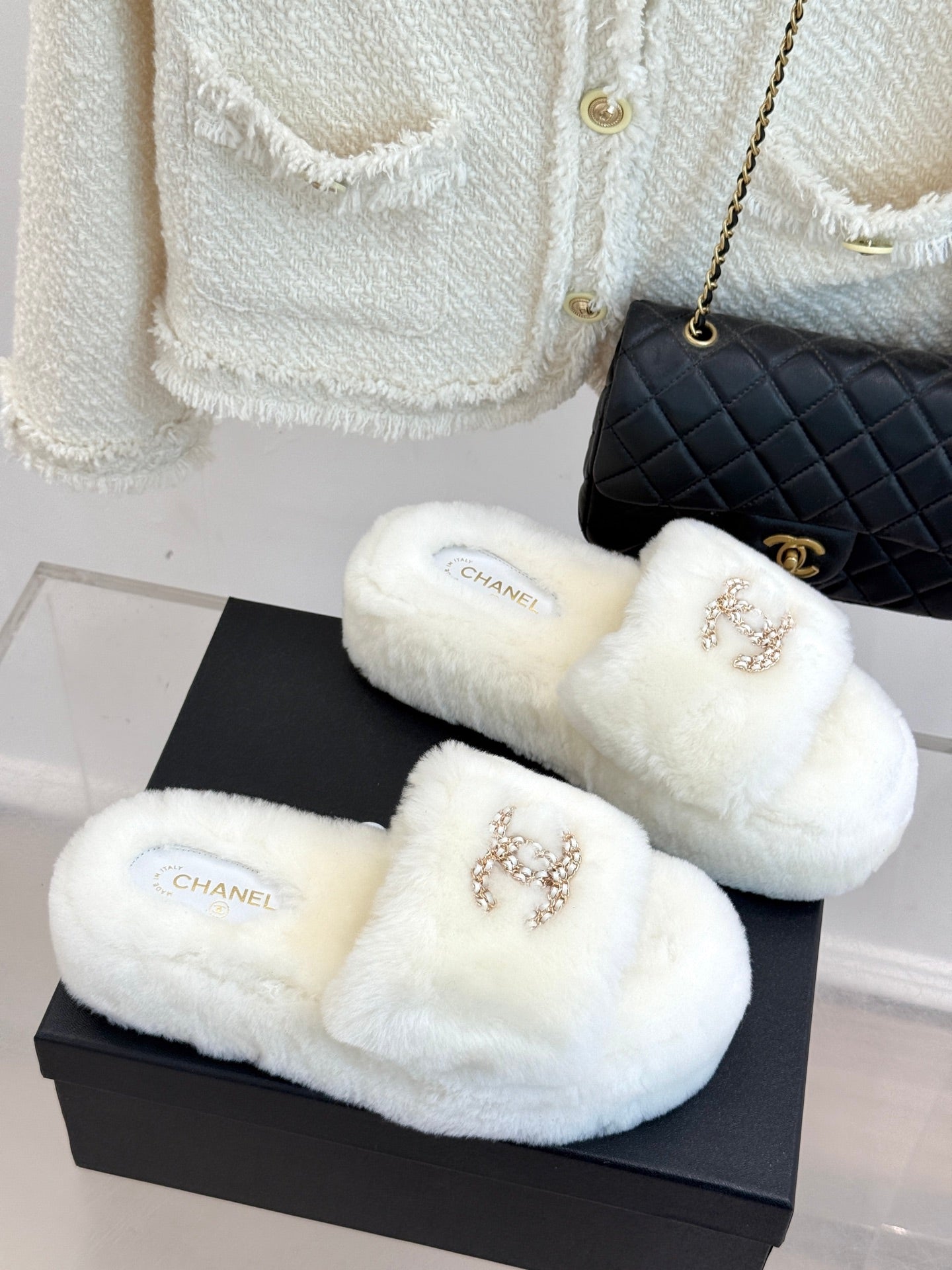 White faux-fur slide sandals with jeweled C logo and Chanel insole