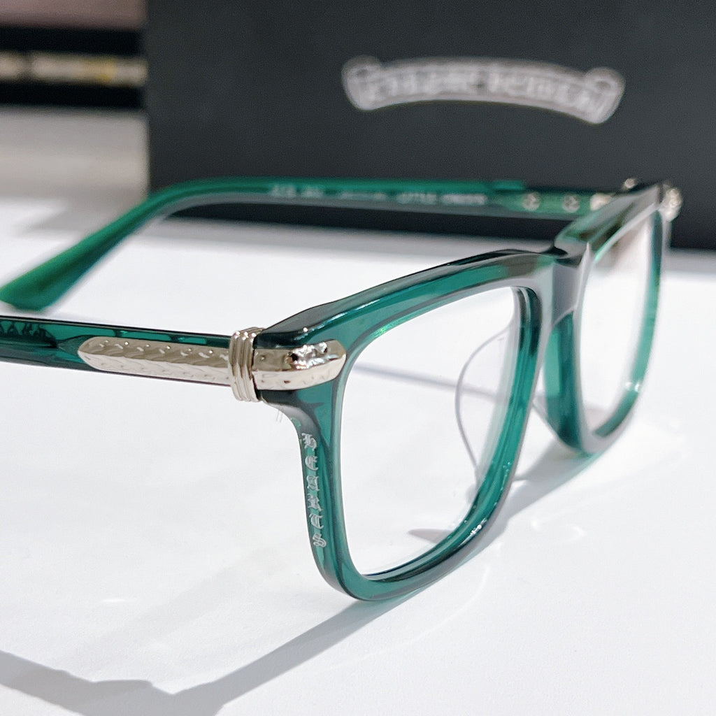 Green clear-lens eyeglasses with silver hinge and metal temples