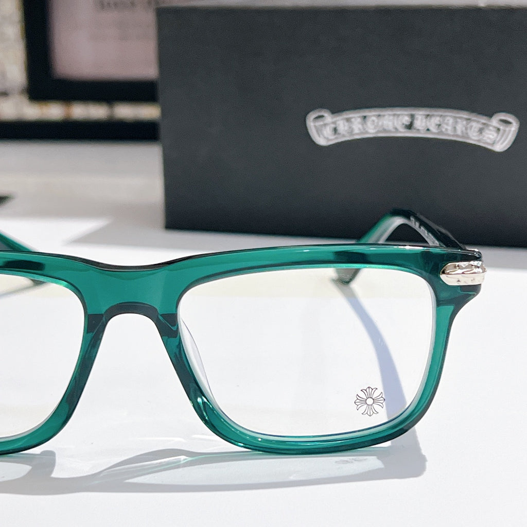 Green clear-lens eyeglasses with thick square frame and metal hinge detail