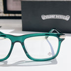 Green clear-lens eyeglasses with thick square frame and metal hinge detail