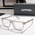 Clear-lens eyeglasses with translucent smoke-gray frame and metal temples