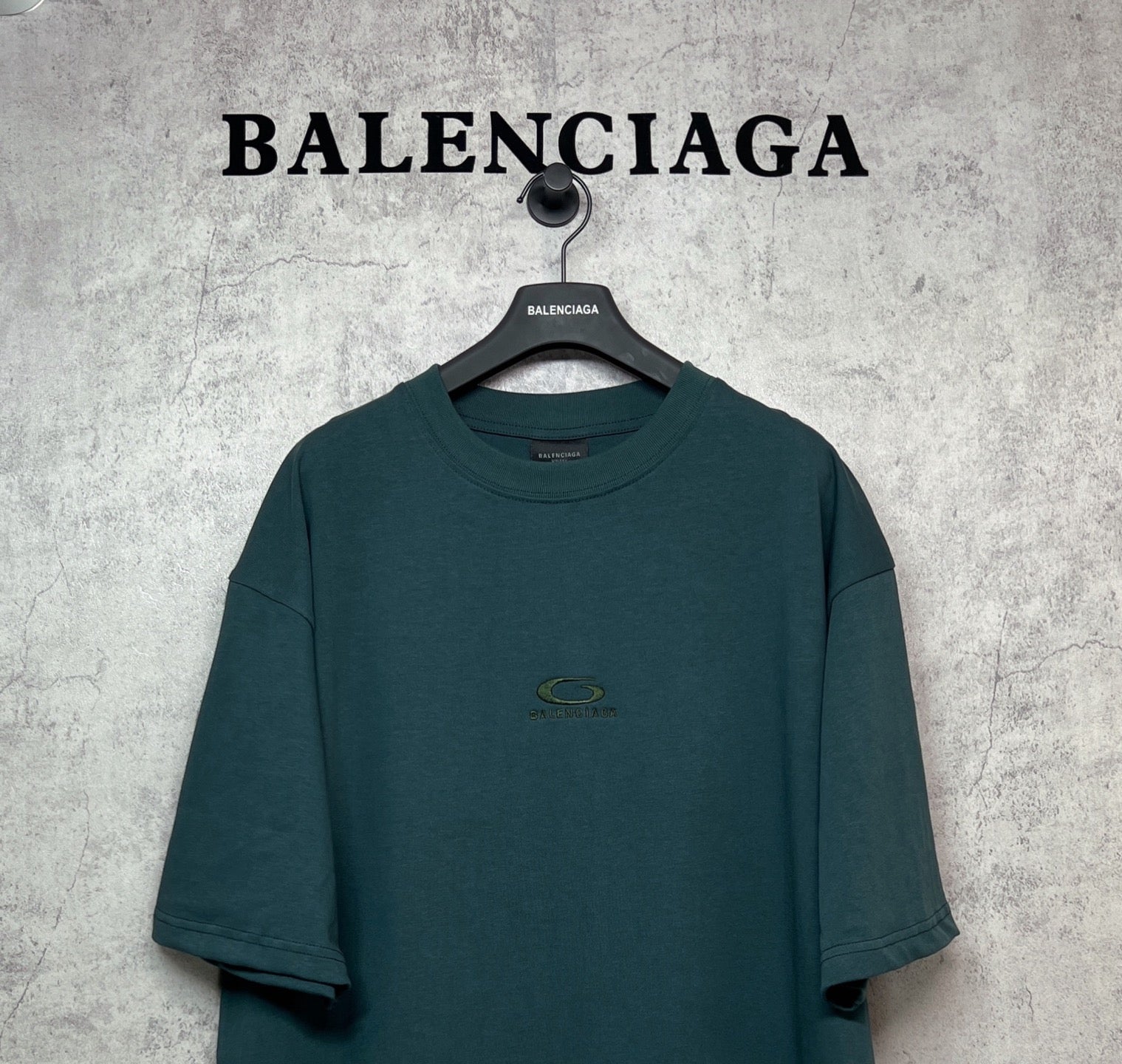 Teal crew-neck short-sleeve T-shirt with small chest emblem logo