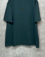 Teal short-sleeve T-shirt front view with small chest emblem and relaxed fit