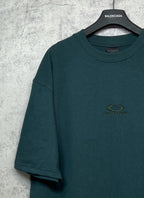 Teal short-sleeve T-shirt with small chest emblem logo and crew neckline