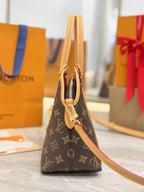 Louis Vuitton monogram handbag with tan shoulder strap and side profile