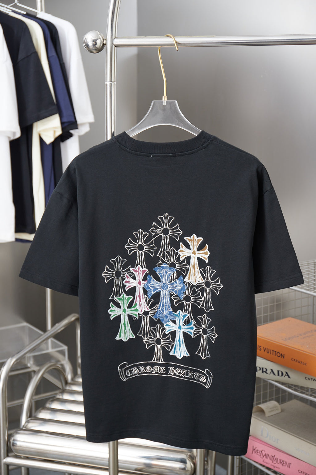 Black graphic T-shirt with multicolor jeweled floral cross design on back