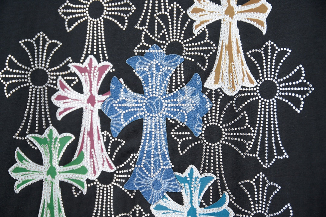 Close-up of multicolor rhinestone floral cross design on black T-shirt