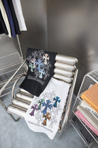 Stacked black and white short-sleeve T-shirts with cross and flower embroidery