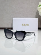 Dior sunglasses with black frames and dark gradient lenses