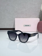 MiuMiu cat-eye sunglasses, dark navy frames with dark gradient lenses